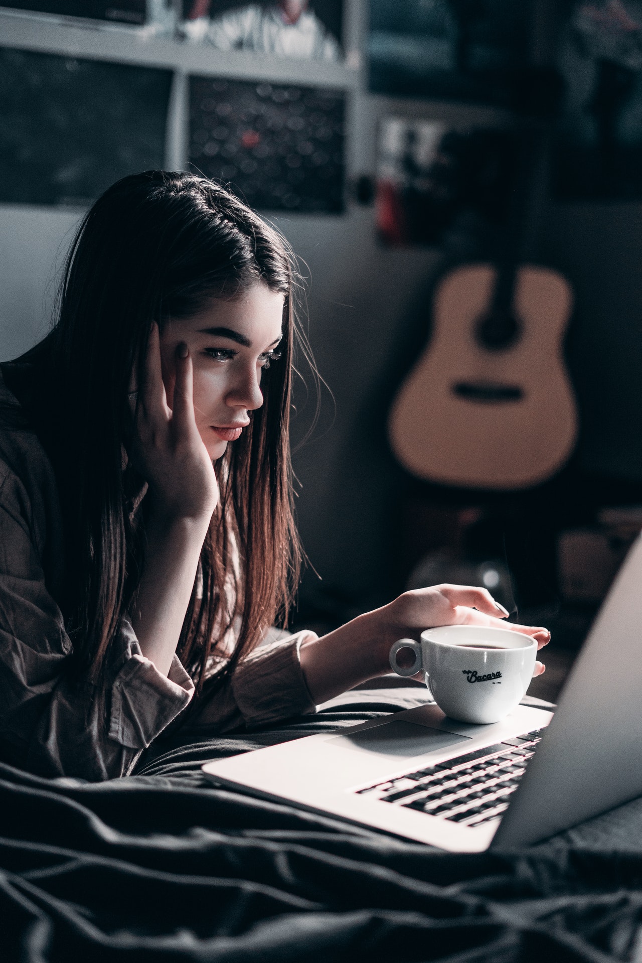 photo-of-woman-lying-on-bed-while-using-laptop-4066041.jpg